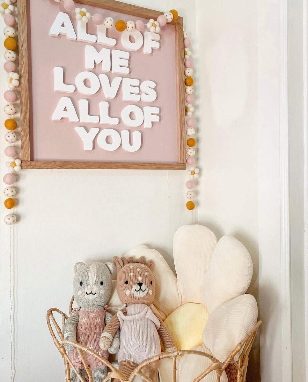 All of me love all of you- white cutout letters light peachy/pink background